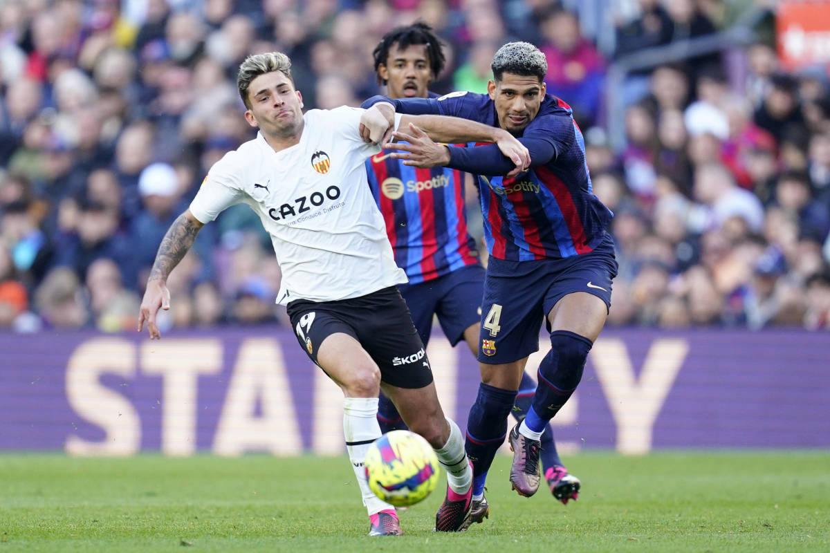 Ronald Araujo pictured (right) fouling Hugo Duro during Barcelona's 1-0 win over Valencia